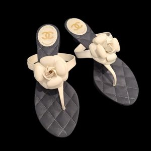 CHANEL IVORY AND BLACK CAMELLIA FLOWER THONG SANDALS #10.5 (41)